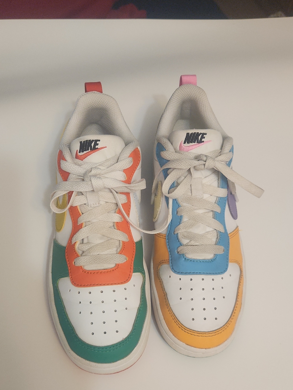 Nike Kids White Sneakers with Green, Orange, Blue & Yellow Accents